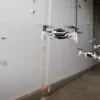 a group of small drones flying in the air
