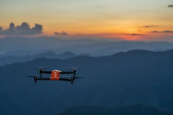 a drone flying over mountains