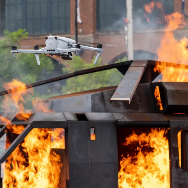 a drone flying over a fire